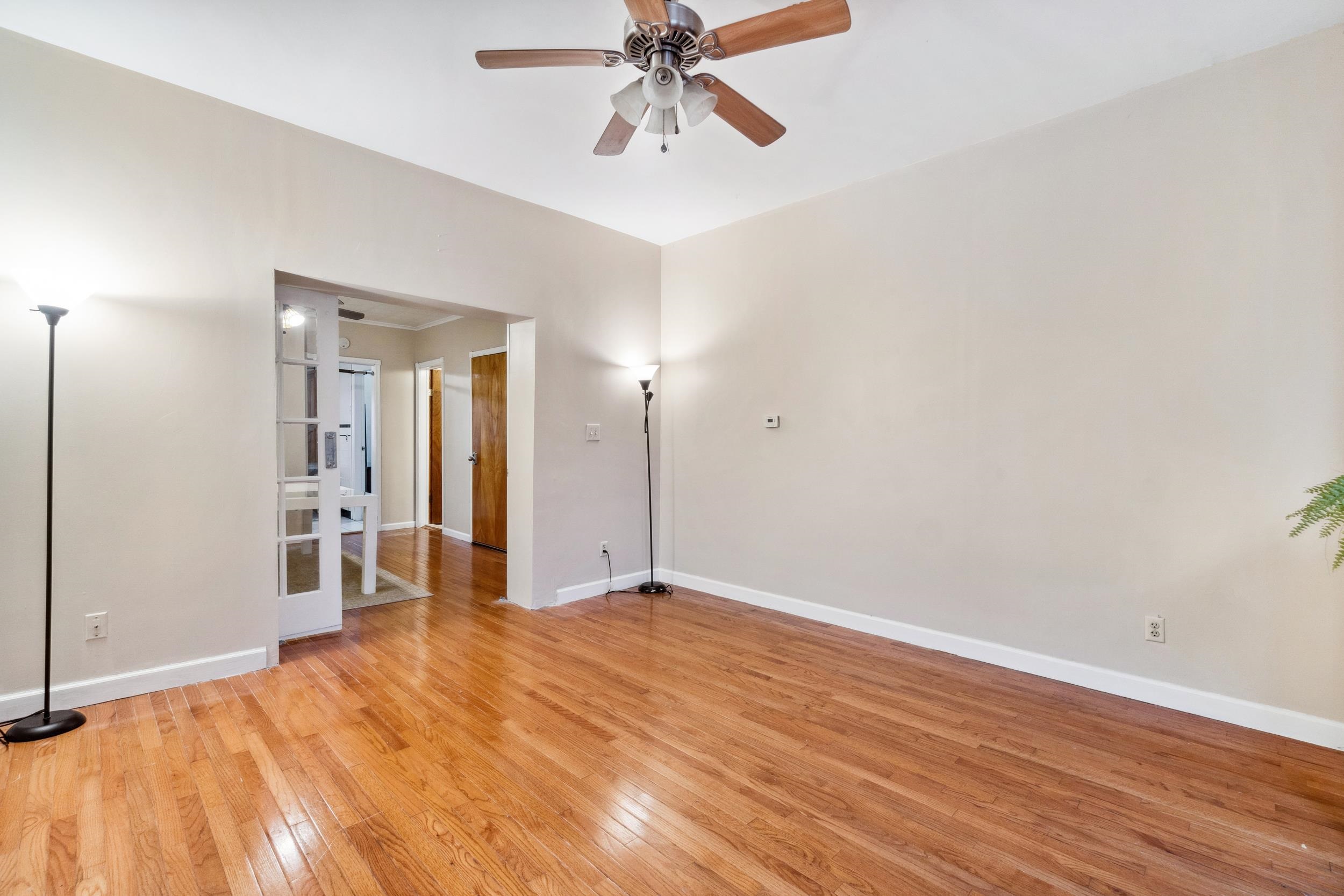 223 Dodd Street, Unit 1 Weehawken, NJ 07086 - Photo 10 of 28 a view of a livingroom with a chandelier fan