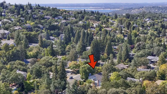 an aerial view of a houses with a yard