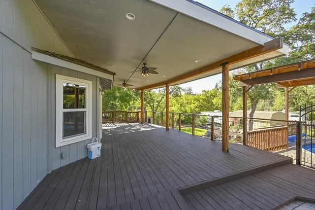 a view of a patio with wooden floor and city view