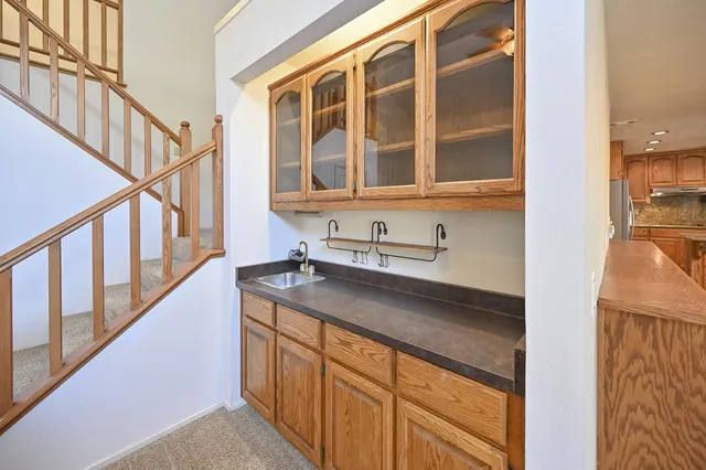 a kitchen with stainless steel appliances granite countertop a sink and dishwasher
