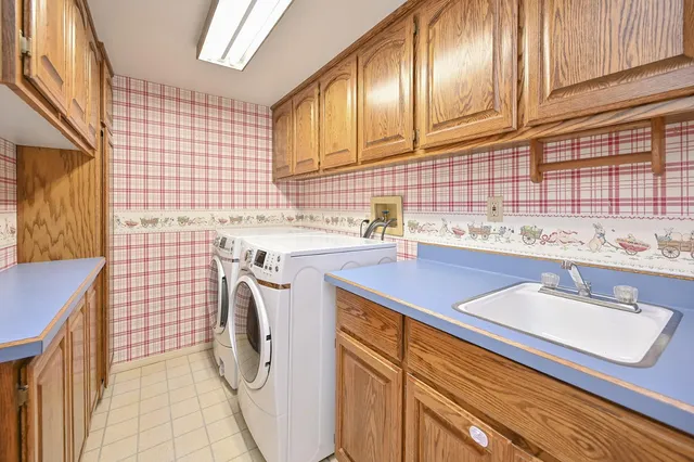 a bathroom with a sink toilet and a mirror