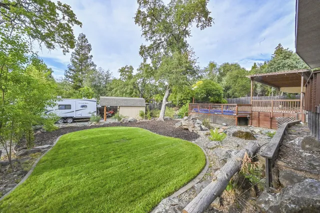 a view of a backyard with sitting area