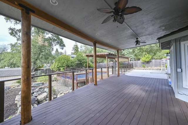a view of a porch with wooden floor and outdoor space