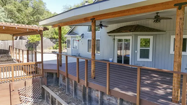 a view of a house with wooden porch