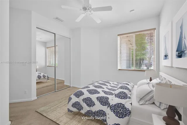 a view of a chairs and table in backyard of the house