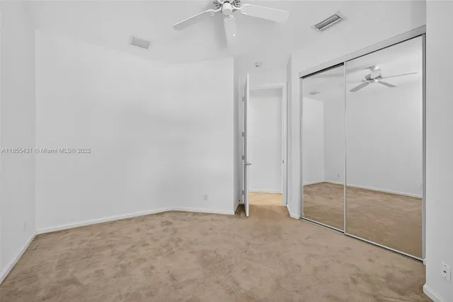 a view of a house with yard and a tree