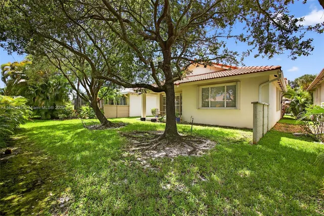 an aerial view of a house with a garden