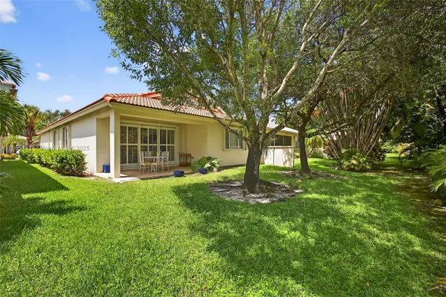 an aerial view of a house with a garden