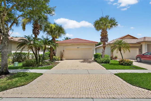 a view of a swimming pool in he middle of the house