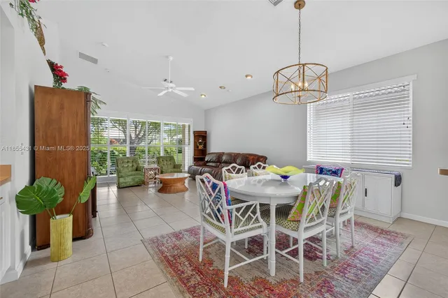 a kitchen with granite countertop a sink stainless steel appliances and cabinets