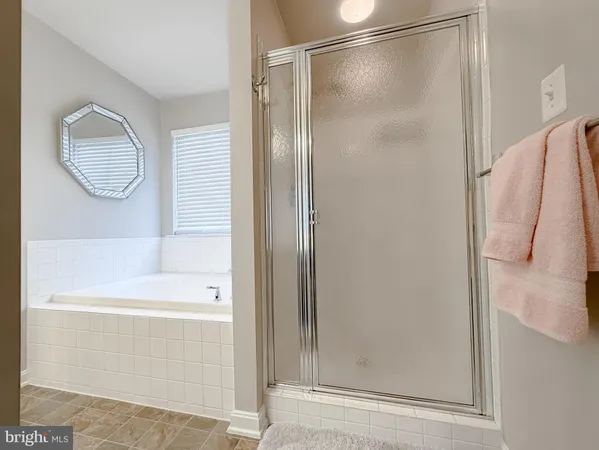 a bathroom with a toilet a sink and a mirror