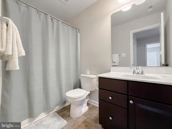 a view of balcony with furniture and wooden floor