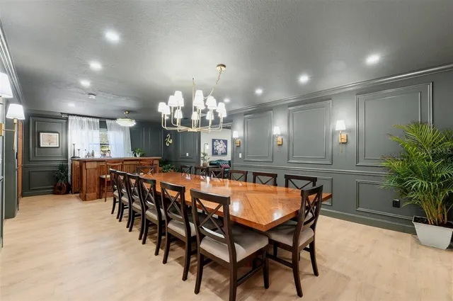 a bathroom with a granite countertop toilet sink and mirror