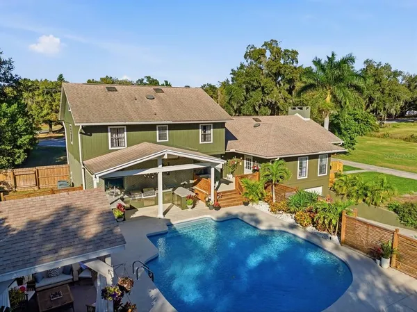 an aerial view of a house with a garden