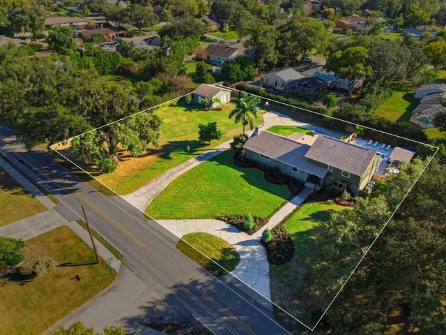 an aerial view of a house with a garden