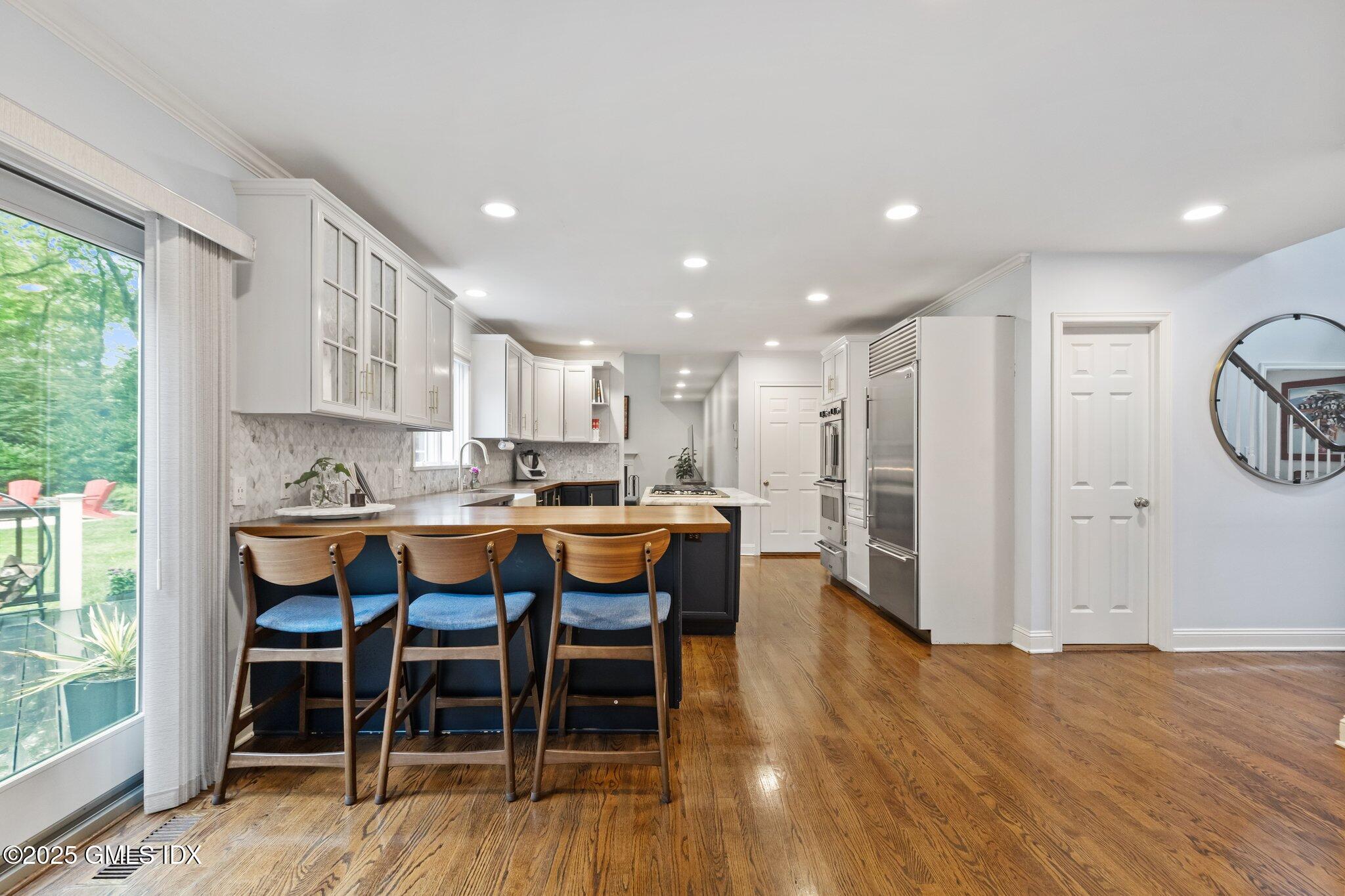 4 Tyler Lane Riverside, CT 06878 - Photo 15 of 27 a kitchen with a table and chairs in it