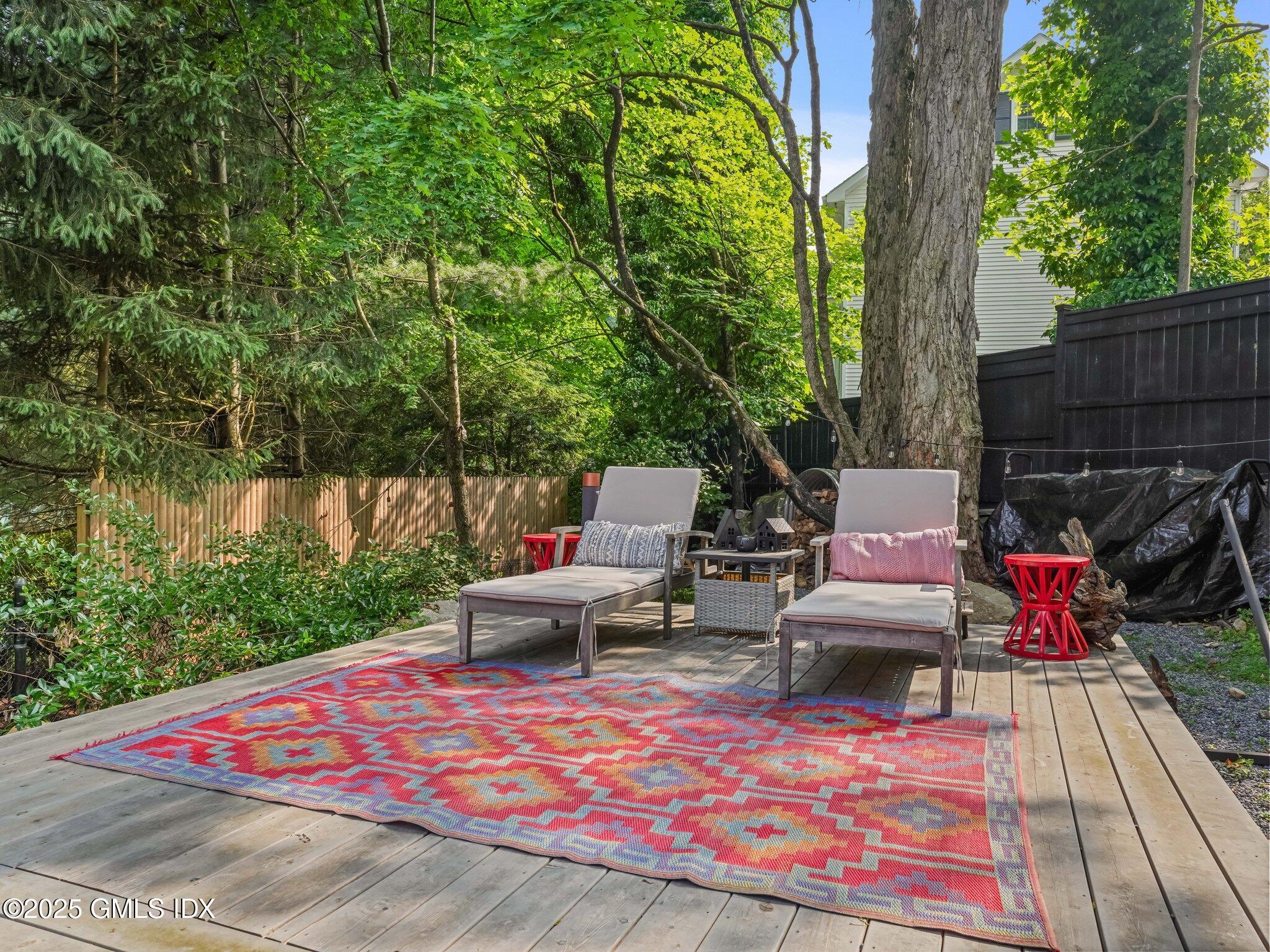 4 Tyler Lane Riverside, CT 06878 - Photo 23 of 27 a view of a backyard with sitting area
