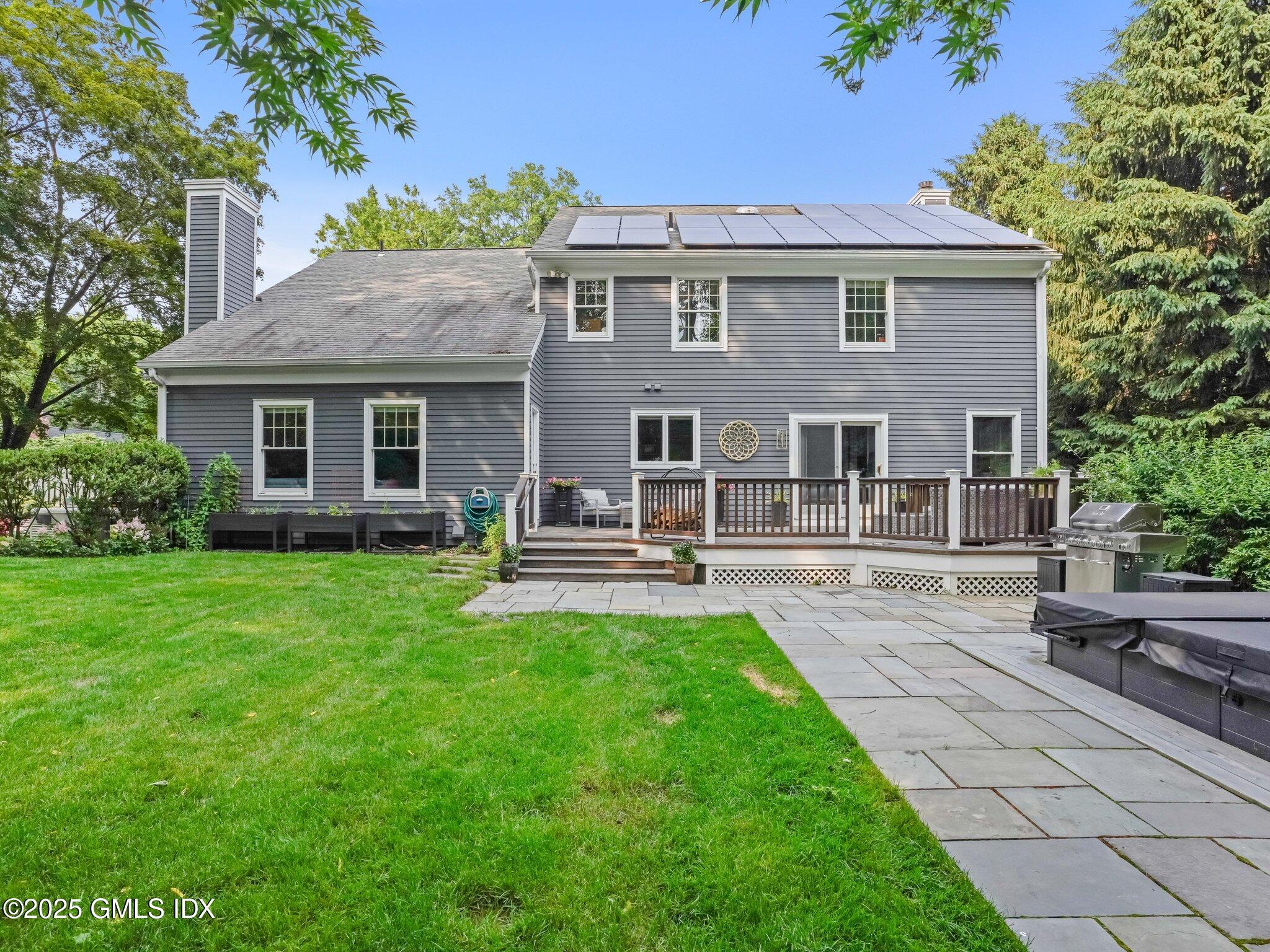 4 Tyler Lane Riverside, CT 06878 - Photo 24 of 27 a front view of a house with a garden