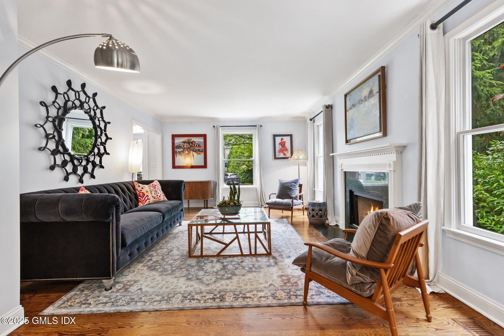 4 Tyler Lane Riverside, CT 06878 - Photo 3 of 27 a living room with furniture and a fireplace