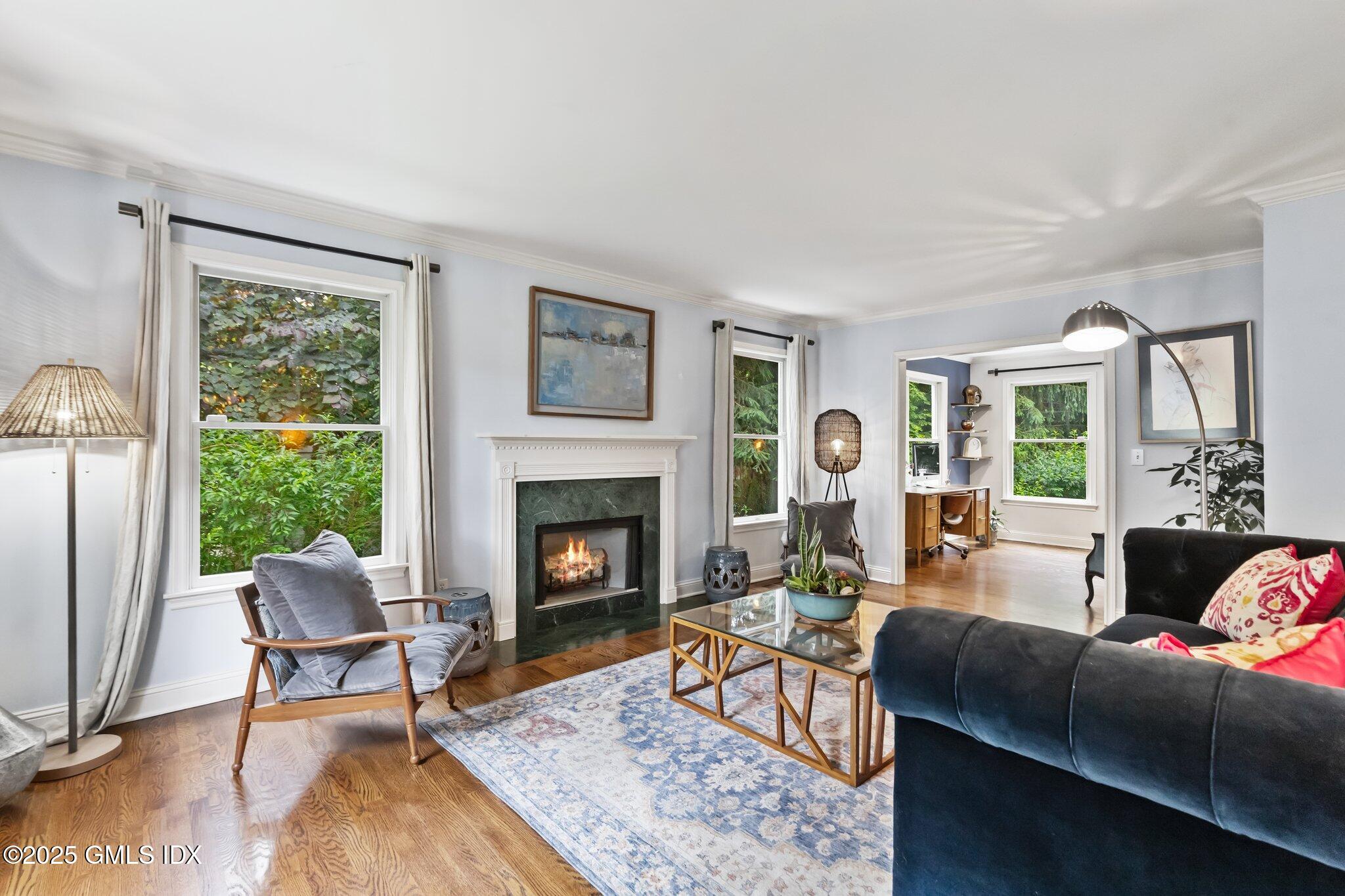 4 Tyler Lane Riverside, CT 06878 - Photo 4 of 27 a living room with furniture and a fireplace