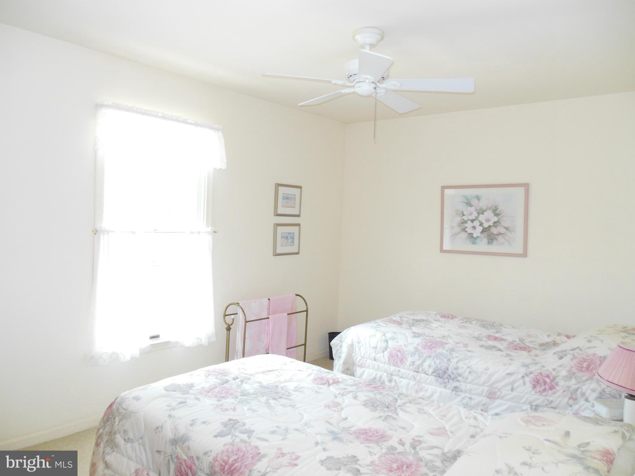 563 Laurel Court Riva, MD 21140 - Photo 21 of 30 a bedroom with a bed and a chandelier