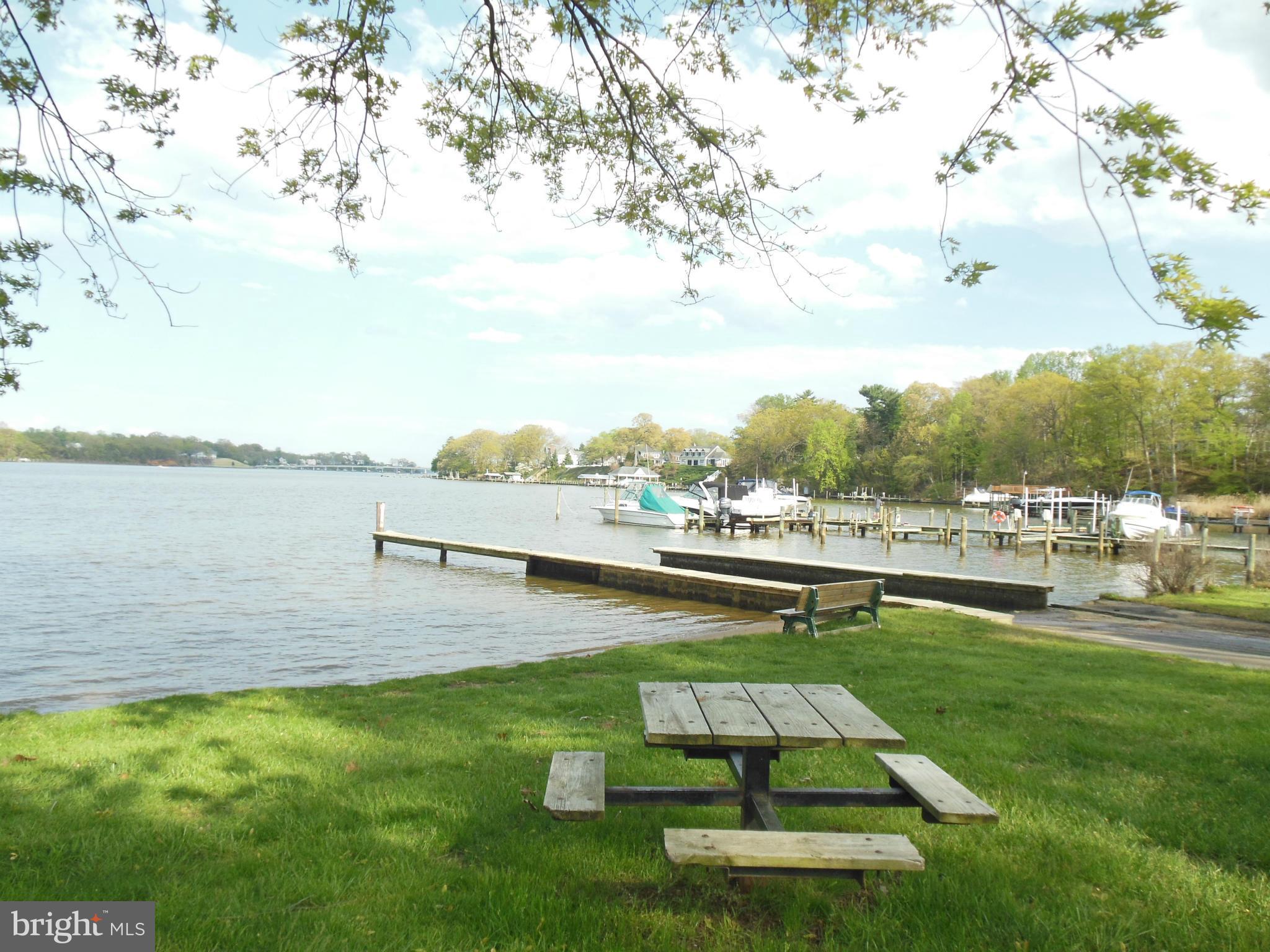 563 Laurel Court Riva, MD 21140 - Photo 28 of 30 a view of a lake with a yard