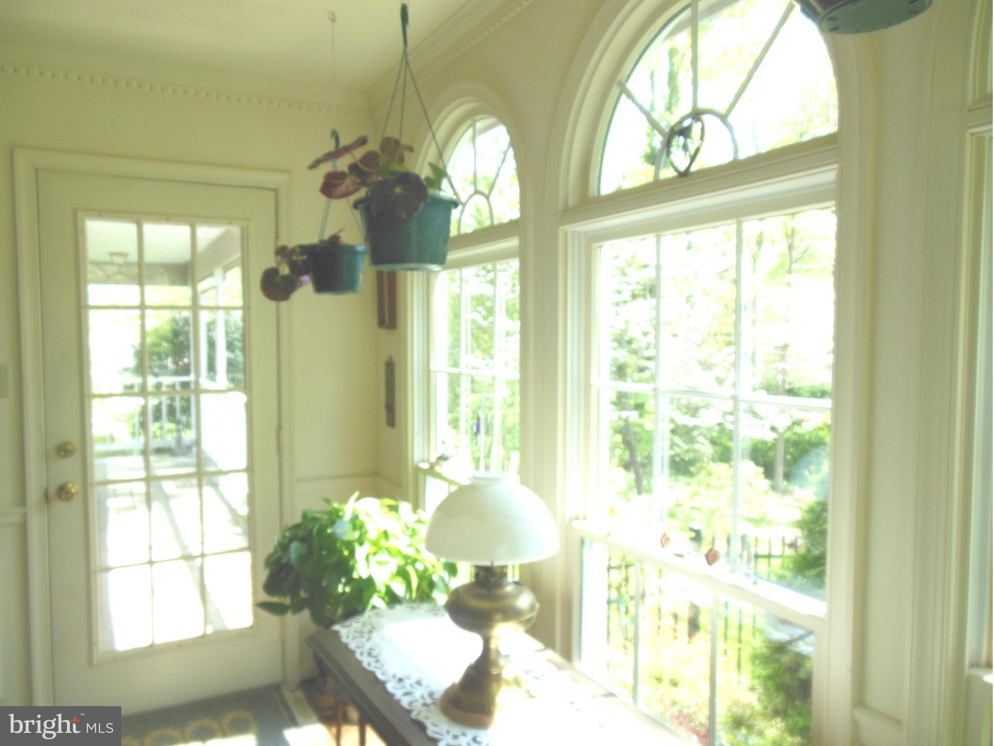 563 Laurel Court Riva, MD 21140 - Photo 10 of 30 a floor to ceiling window and a chandelier