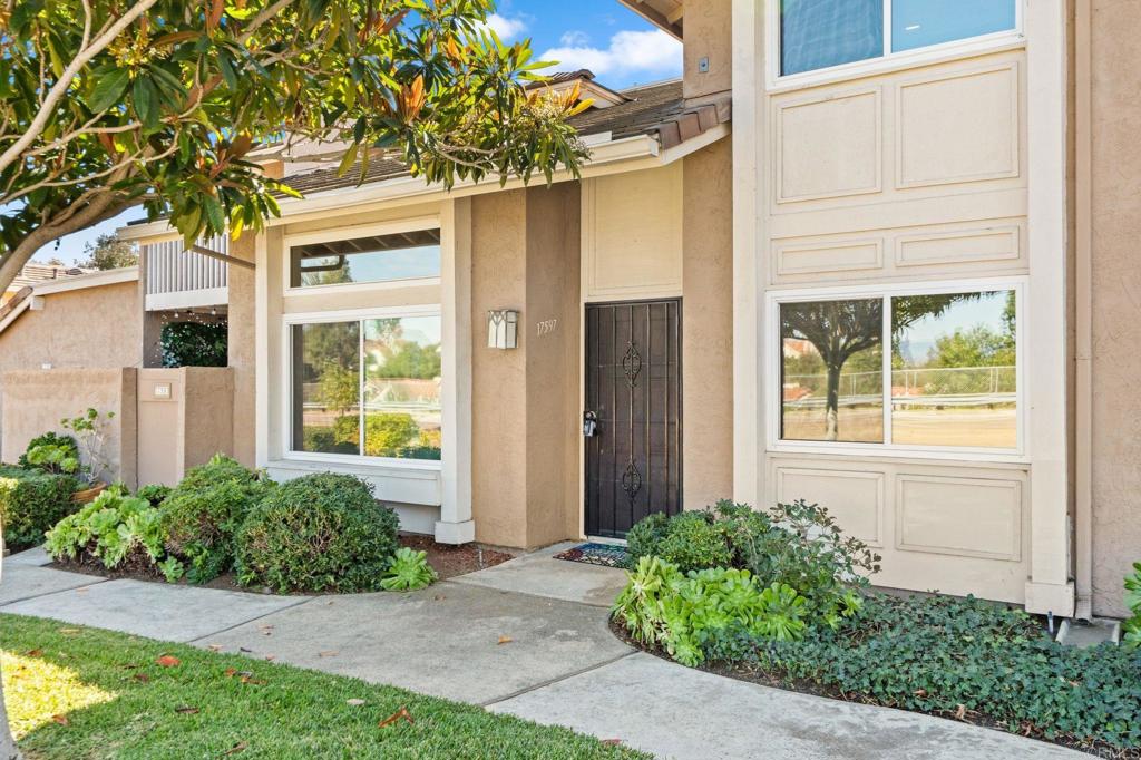 17597 Fairlie Road San Diego, CA 92128 - Photo 2 of 15 a front view of a house with garden