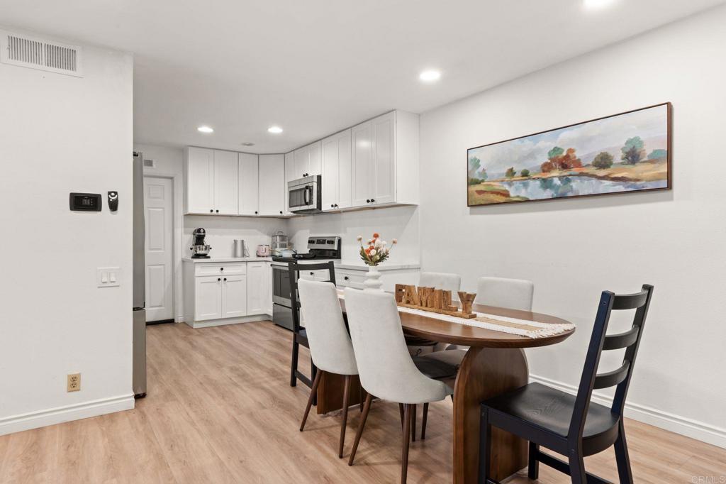 17597 Fairlie Road San Diego, CA 92128 - Photo 3 of 15 a view of kitchen with cabinets and wooden floor