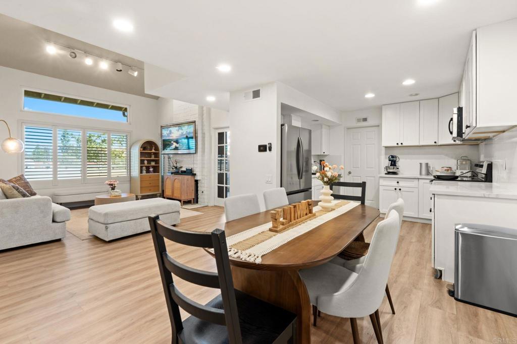 17597 Fairlie Road San Diego, CA 92128 - Photo 5 of 15 a view of a dining room with furniture a rug and wooden floor