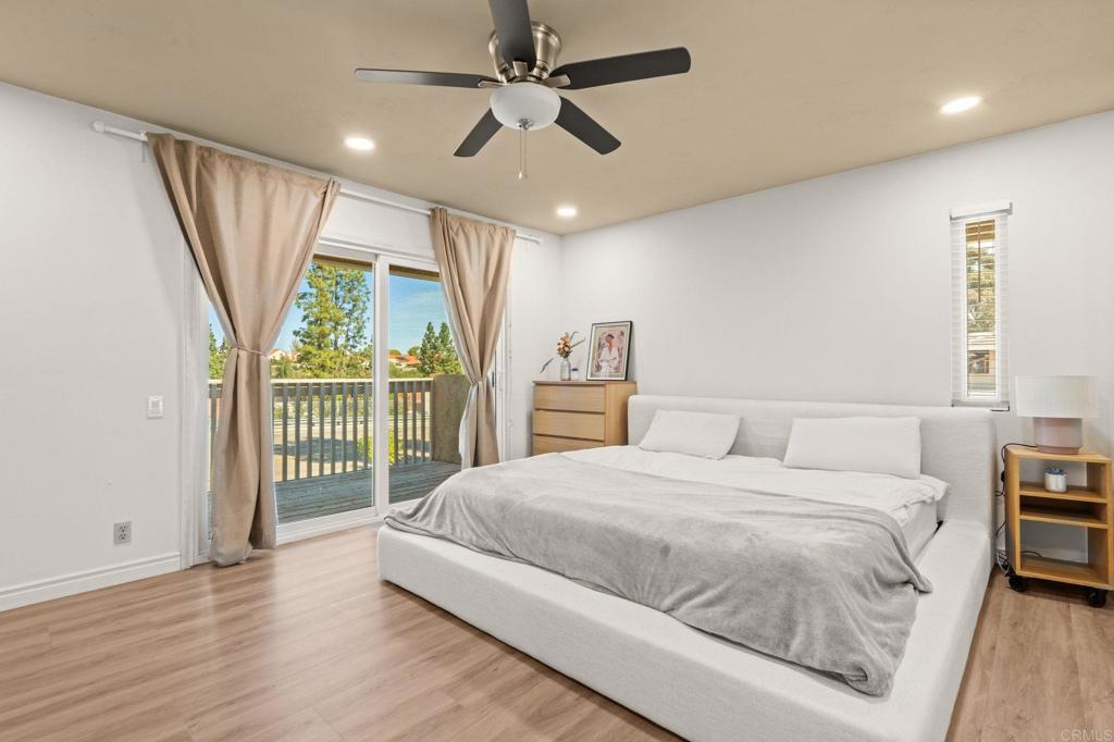 17597 Fairlie Road San Diego, CA 92128 - Photo 7 of 15 a bedroom with a large bed and a large window