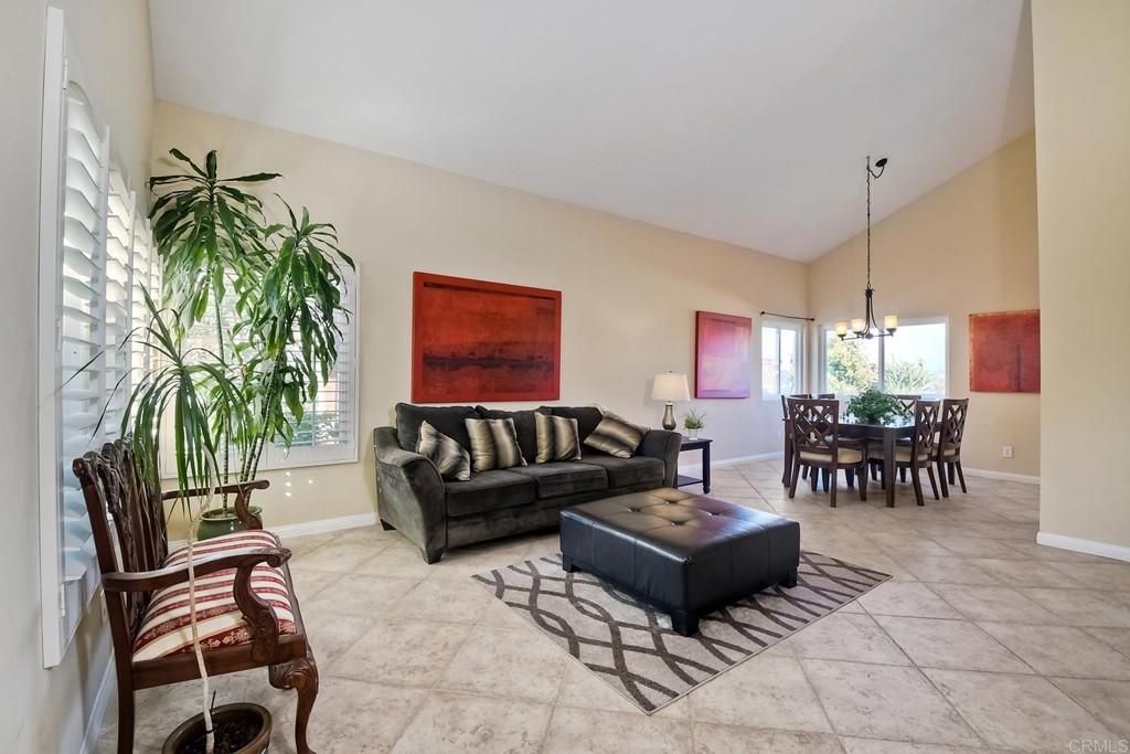 2754 Olympia Drive Carlsbad, CA 92010 - Photo 2 of 35 a living room with furniture and a potted plant