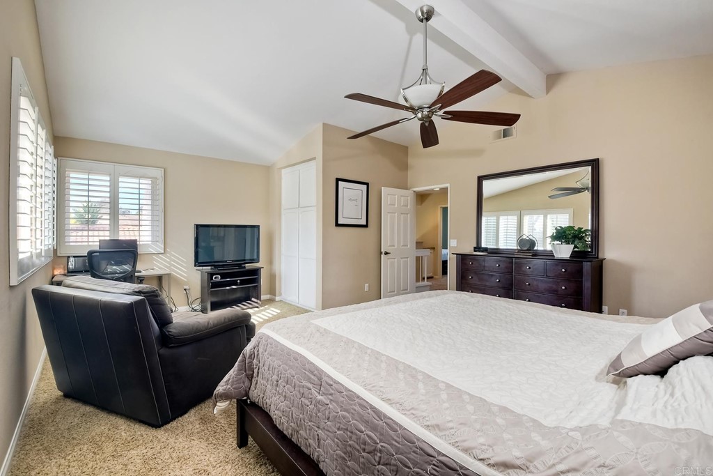 2754 Olympia Drive Carlsbad, CA 92010 - Photo 20 of 35 a bedroom with a bed a couch and dresser