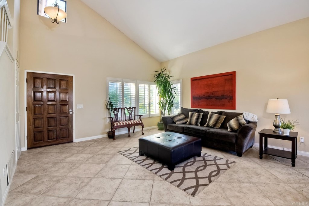 2754 Olympia Drive Carlsbad, CA 92010 - Photo 3 of 35 a living room with furniture and a lamp