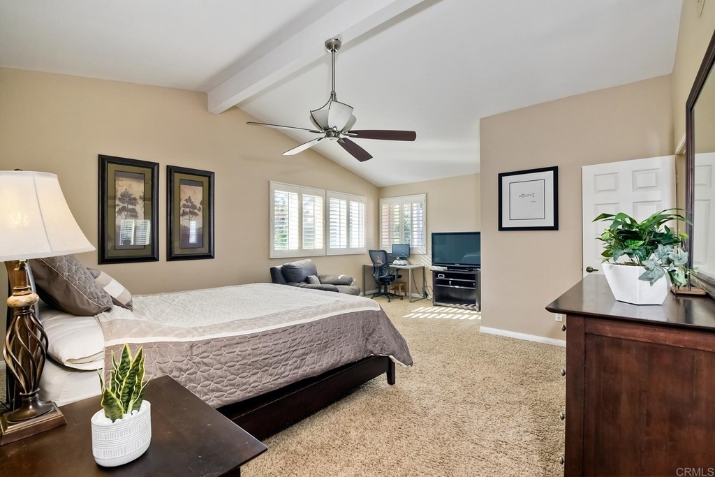 2754 Olympia Drive Carlsbad, CA 92010 - Photo 21 of 35 a bedroom with a bed and ceiling fan