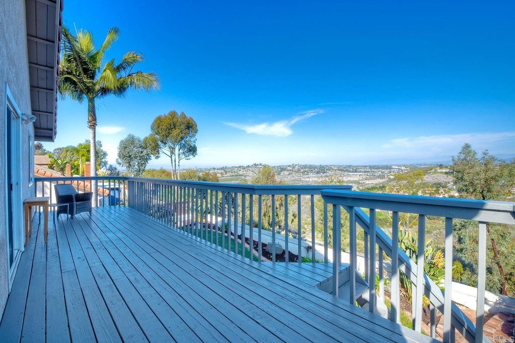 2754 Olympia Drive Carlsbad, CA 92010 - Photo 25 of 35 a view of a balcony with wooden floor and outdoor space