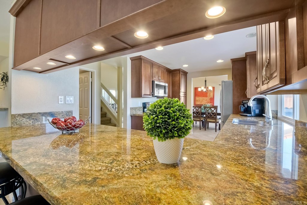 2754 Olympia Drive Carlsbad, CA 92010 - Photo 9 of 35 a view of a dining room with furniture