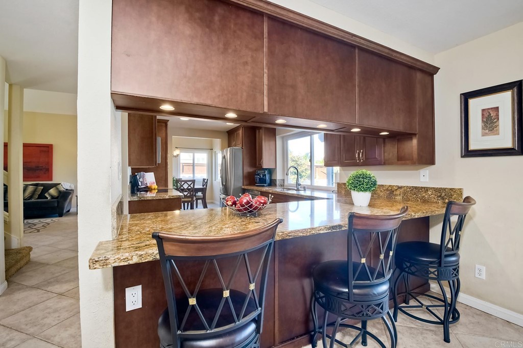 2754 Olympia Drive Carlsbad, CA 92010 - Photo 10 of 35 a view of a dining room with furniture and chandelier