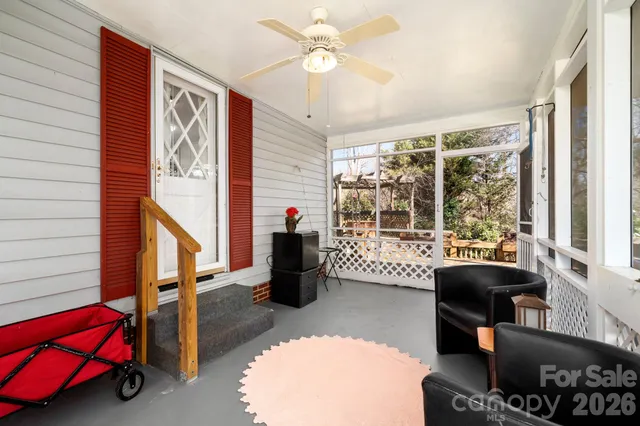 a view of a roof deck with furniture