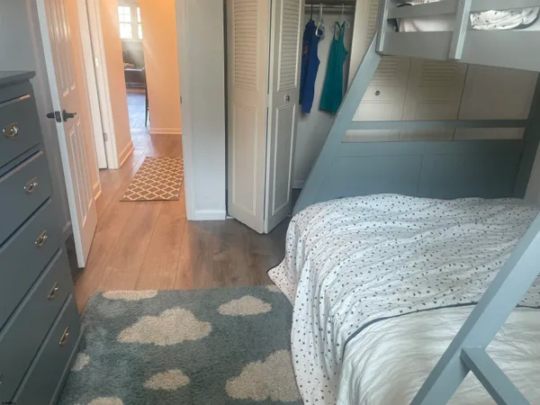 a bedroom with a bed and a couch