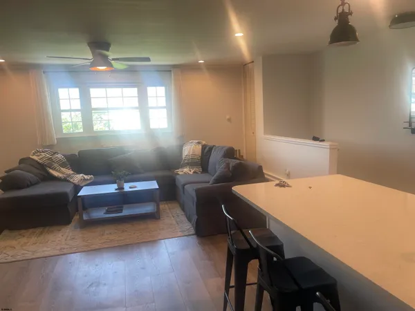 a bed sitting in a bedroom next to a wooden cabinet