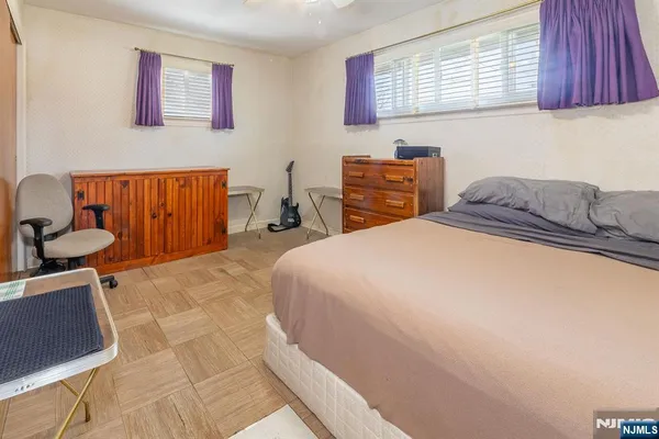 a bedroom with a bed and furniture