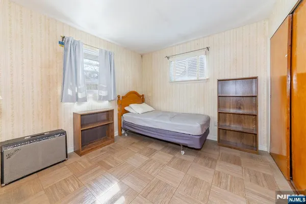 a bedroom with a bed and a cabinets