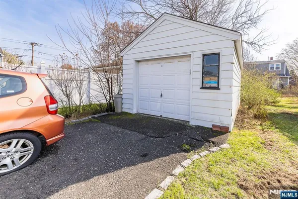 a front view of a house with garage