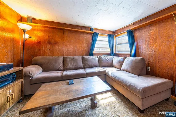 a living room with a couch and a window