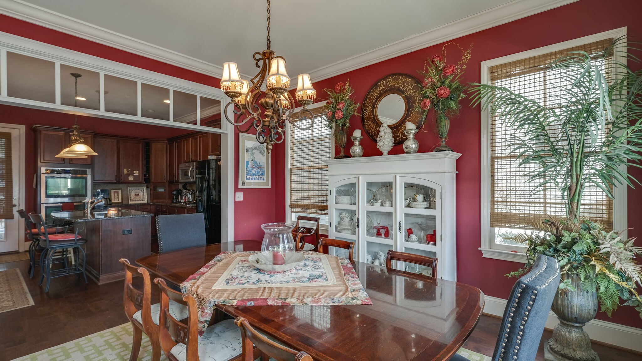 1011 Rural Plains Circle Franklin, TN 37064 - Photo 20 of 36 a view of a dining room with furniture chandelier and wooden floor