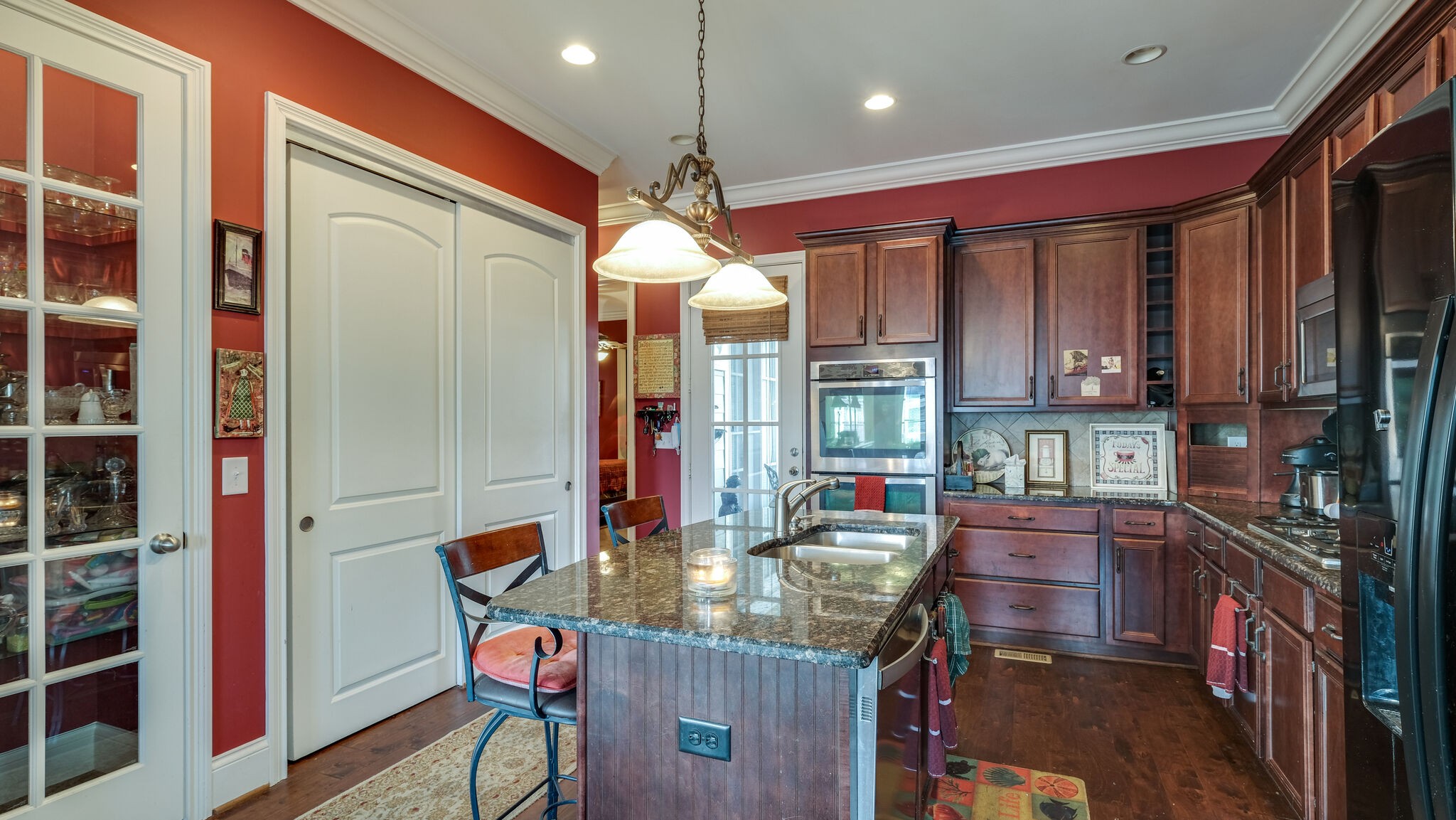 1011 Rural Plains Circle Franklin, TN 37064 - Photo 26 of 36 a kitchen area with granite countertop lots of counter top space and dining table