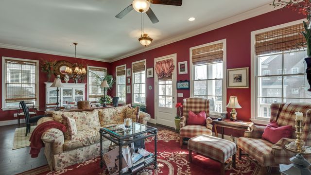 a bathroom with double vanity and a mirror