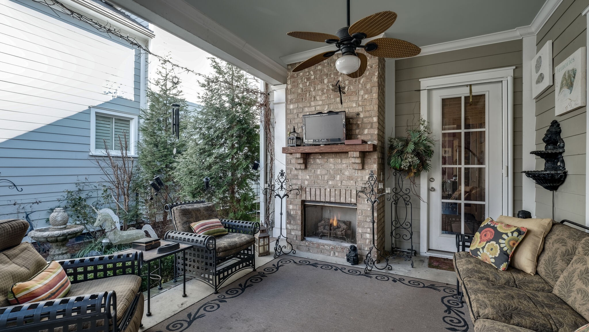 1011 Rural Plains Circle Franklin, TN 37064 - Photo 30 of 36 a living room with furniture a fireplace and a flat screen tv