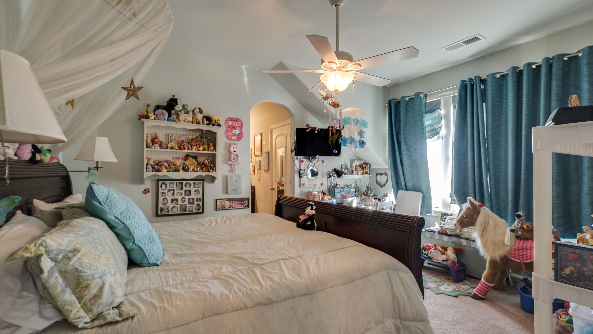 1011 Rural Plains Circle Franklin, TN 37064 - Photo 9 of 36 a bedroom with a bed couch and flat tv screen